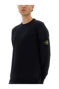 Stone Island men’s black crewneck sweater with yellow logo patch on left sleeve made from lightweight wool