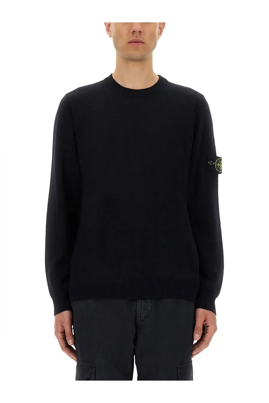 Stone Island men’s black knit lightweight wool sweater with subtle yellow logo patch on the left sleeve