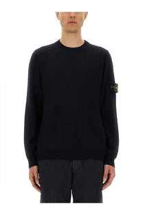 Stone Island men’s black knit lightweight wool sweater with subtle yellow logo patch on the left sleeve