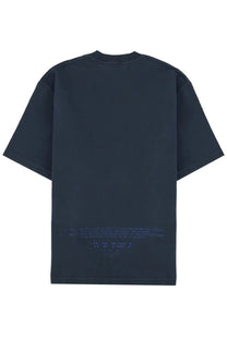 Dark navy blue oversized stone island men’s t-shirt with faintly glowing blue text print along the bottom hem