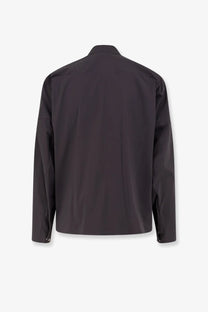 Stone island men’s shirt grey featuring a sleek black long-sleeved jacket with a modern minimalist design front view