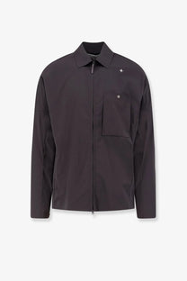 Stone Island men’s dark gray zip-front jacket with subtle star logo and flap pocket in sleek design