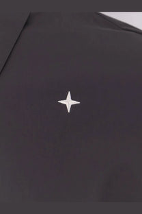 Stone Island men’s grey shirt featuring a small white embroidered star patch on black fabric detail