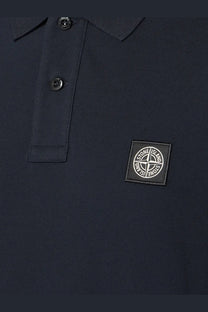 Stone Island men’s stretch organic cotton polo shirt in dark navy blue with black embroidered logo patch on the chest