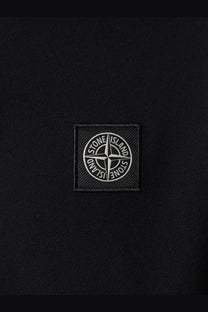 Stone Island men’s black polo shirt made of stretch organic cotton with a white embroidered compass patch