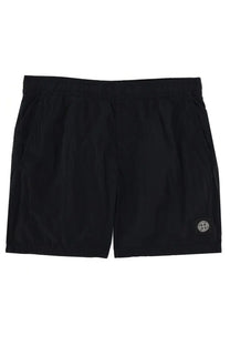 Stone island men’s swimsuit blue featuring black athletic shorts with subtle textured fabric and circular logo patch