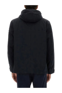 Stone island men’s waterproof jacket blue in dark navy with hood sleek minimalist design and subtle seam detailing