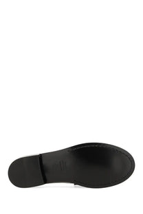 Black leather sole of stuart weitzman women’s moccasin lottie multicolor with glossy finish and visible stitching