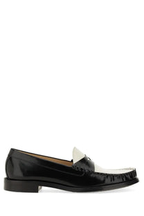 Stuart Weitzman women’s moccasin Lottie multicolor black patent leather loafer with white toe cap and stitched detailing