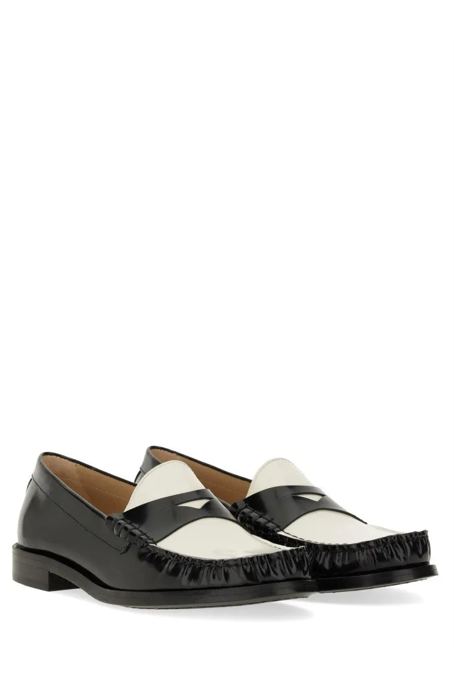 Stuart Weitzman women’s moccasin Lottie black and white patent leather loafers with frayed edge detail