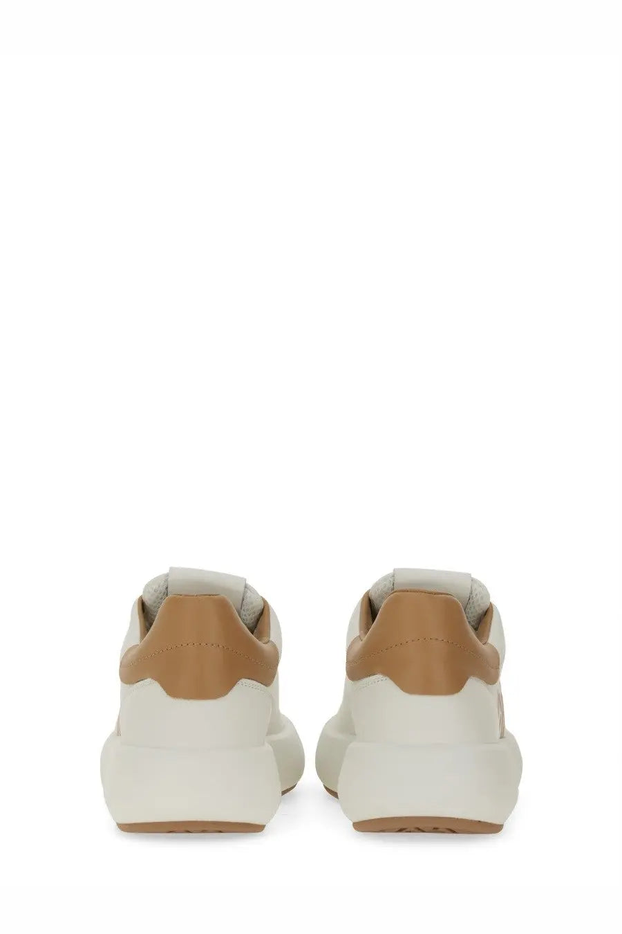Stuart Weitzman women’s SW Pro sneaker in cream and tan leather with a chunky white sole for casual wear