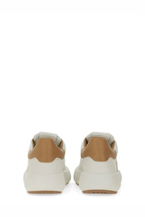 Stuart Weitzman women’s SW Pro sneaker in cream and tan leather with a chunky white sole for casual wear