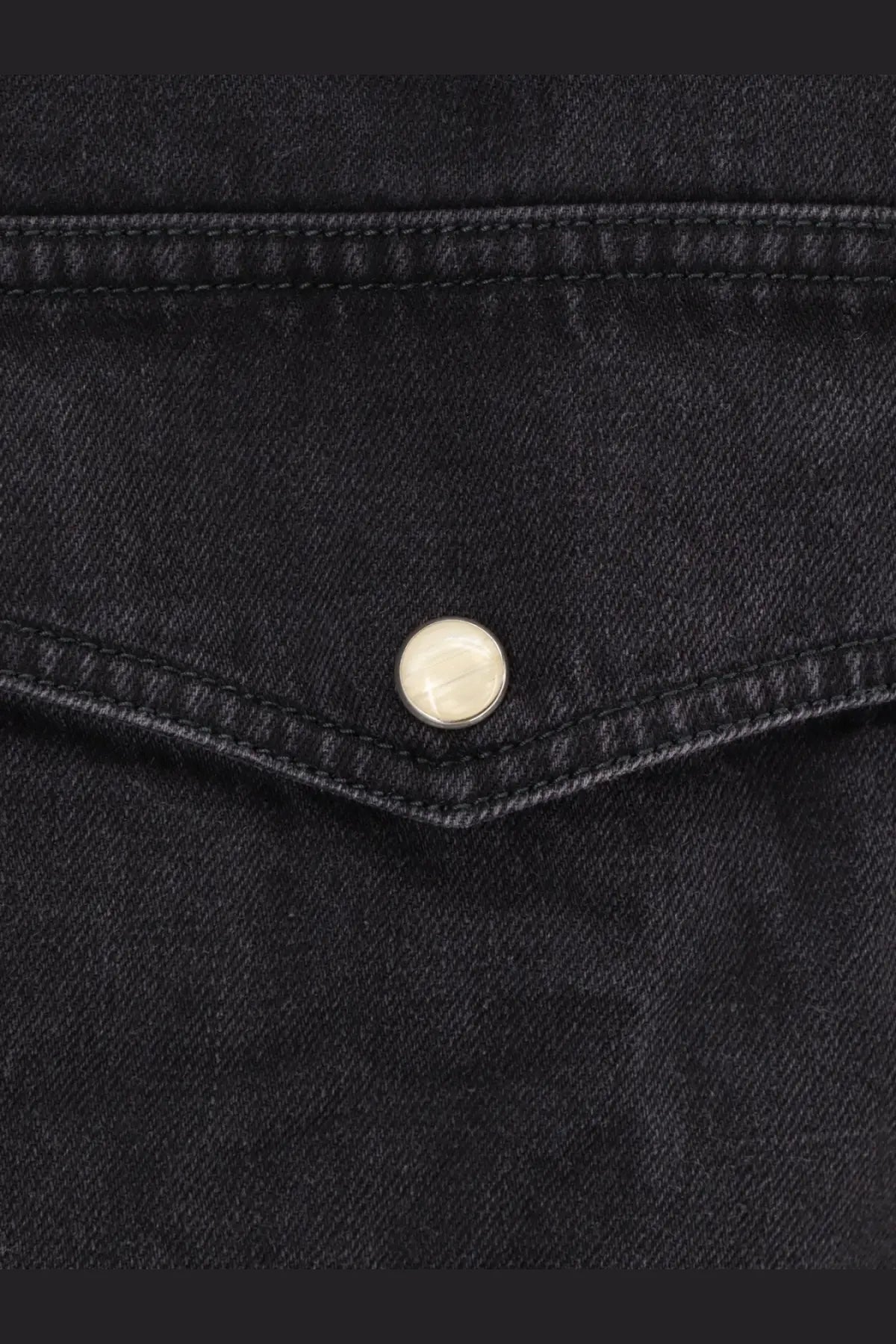 Studio nicholson men’s black denim shirt black featuring a silver button on a black denim jacket front