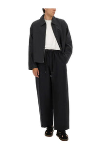 Studio Nicholson men’s harrington jacket grey oversized black with structured collar and front zipper over white tee