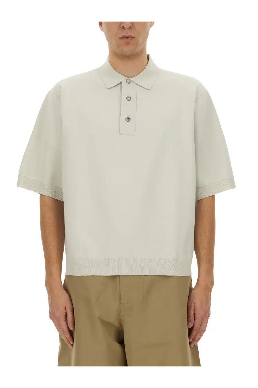 Studio Nicholson men’s knitted polo white in off-white with short sleeves classic collar and three matching buttons