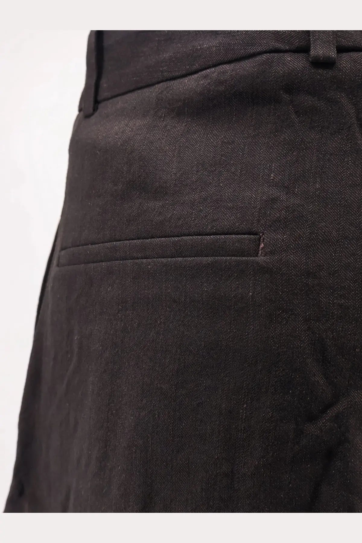 Black textured wool blend trousers with subtle weave and tailored design from studio nicholson mens oversized collection
