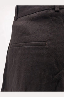 Black textured wool blend trousers with subtle weave and tailored design from studio nicholson mens oversized collection
