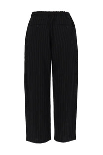 Studio Nicholson men’s black pinstripe wide-leg trousers with drawstring waistband made from lightweight fabric