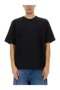 Studio nicholson men’s black crew neck t-shirt with relaxed fit and short sleeves in minimalist design