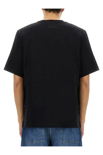 Studio nicholson men’s black short-sleeved t-shirt with subtle brand logo at the neckline in a soft fabric