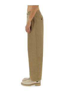 Studio Nicholson men’s slim curved beige chino trousers with straight legs, classic belt loops, and subtle stitching details