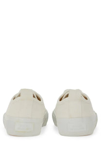 Cream-colored canvas slip-on sneakers with minimalist design and white rubber soles studio nicholson men’s sneaker byrd white