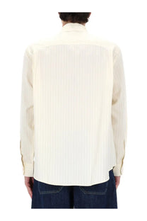 Studio nicholson men’s view shirt white is a cream-colored pleated cotton shirt with classic collar and long sleeves