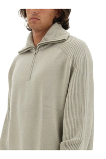 Studio Nicholson men’s wool jersey beige light gray ribbed knit sweater with half-zip collar and vertical sleeve stripes