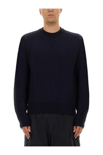 Studio Nicholson men’s wool jersey blue knit sweater in navy with ribbed hem and cuffs for comfortable layering