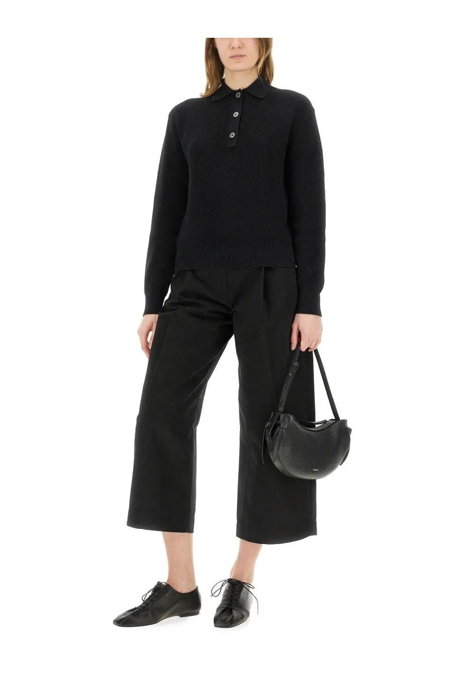 Black leather crescent-shaped handbag with short shoulder strap featured with Studio Nicholson women’s Chesapeake knit polo shirt black