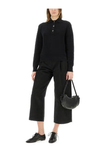 Black leather crescent-shaped handbag with short shoulder strap featured with Studio Nicholson women’s Chesapeake knit polo shirt black