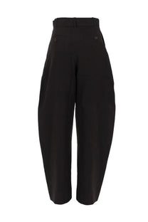 Studio nicholson women’s pantalone gamba larga brown featuring black high-waisted wide-leg trousers with back pleats