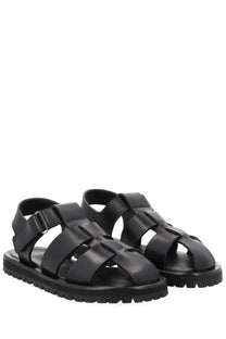 Studio nicholson women’s black leather sandals with woven strap design and chunky rubber sole