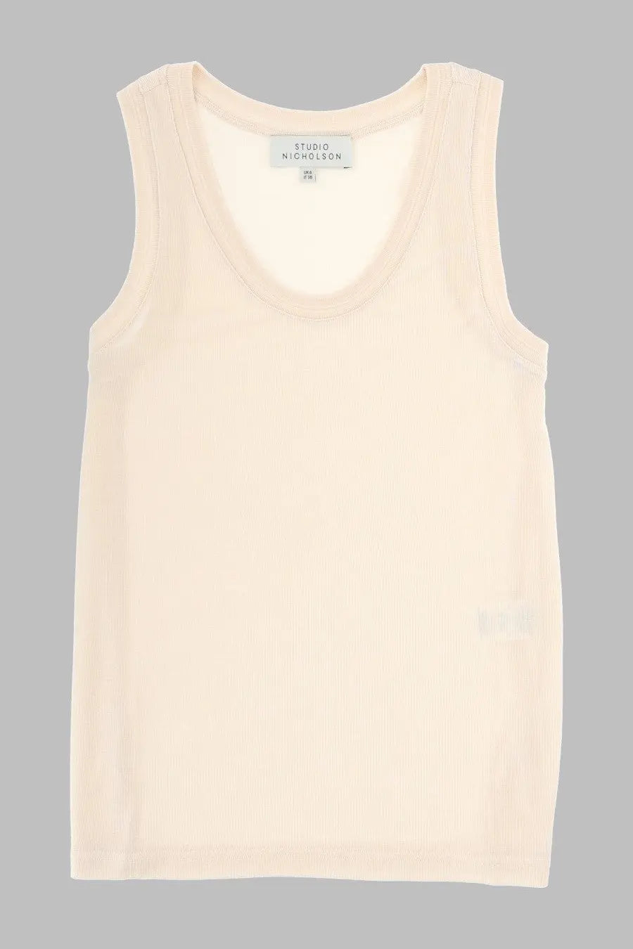 Studio Nicholson women’s tank top in lyocell white is a soft cream sleeveless top with a round neckline and subtle seams