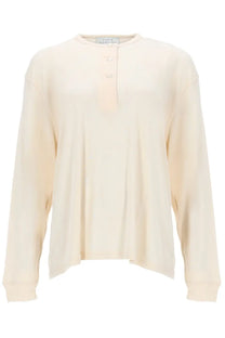 Studio Nicholson womens cream long sleeved henley top with soft flowing fabric and subtle front pleats