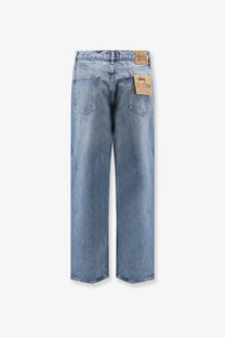 Stussy men’s big ol jean blue light-wash denim jeans back side with relaxed wide-leg cut and brown leather brand tags