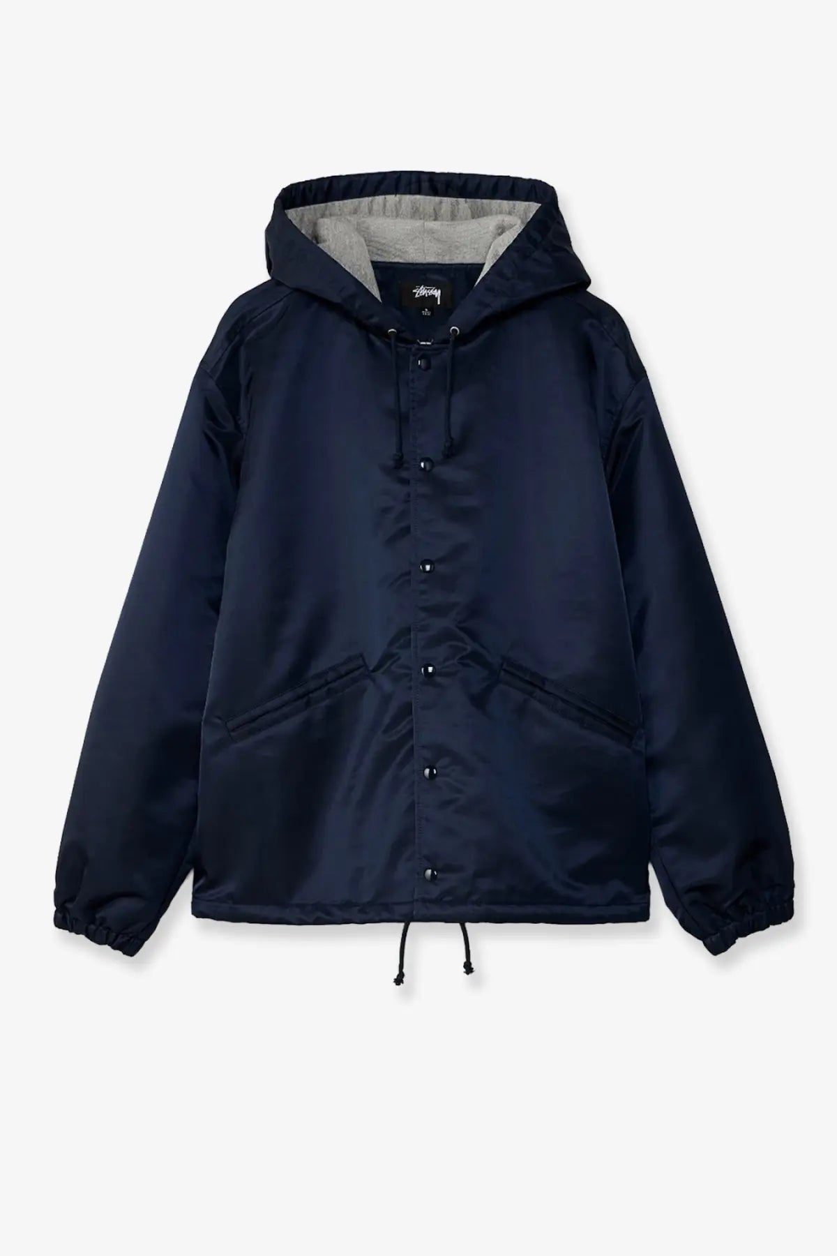 Stussy men’s nylon coach jacket in dark navy with satin finish hood button front and drawstring waist