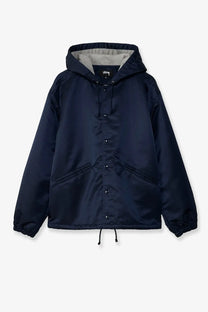 Stussy men’s nylon coach jacket in dark navy with satin finish hood button front and drawstring waist