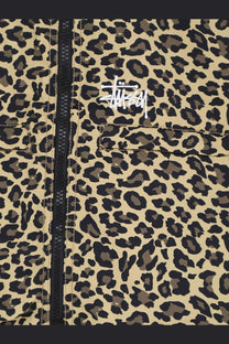 Beige and black leopard-print stussy men’s nylon jacket with a white logo patch on the chest
