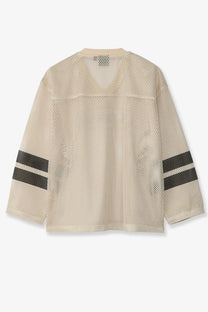 Stussy men’s beige perforated nylon football jersey with black striped sleeves and breathable mesh design