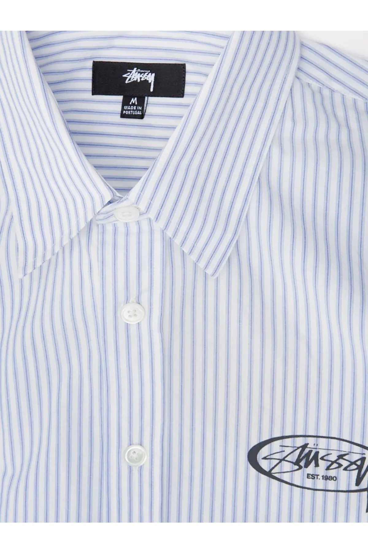 Stussy men’s standard striped cotton shirt blue with white and light blue vertical stripes and black logo patch at collar