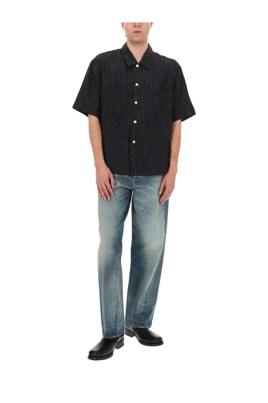Black short-sleeved button-up shirt with fine vertical stripes paired with sunflower men’s jeans wide twist blue