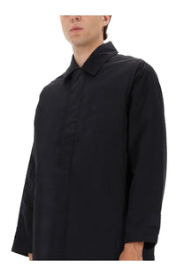 Sunflower men’s relaxed black trench coat with minimalist design, structured collar, and subtle seam detailing
