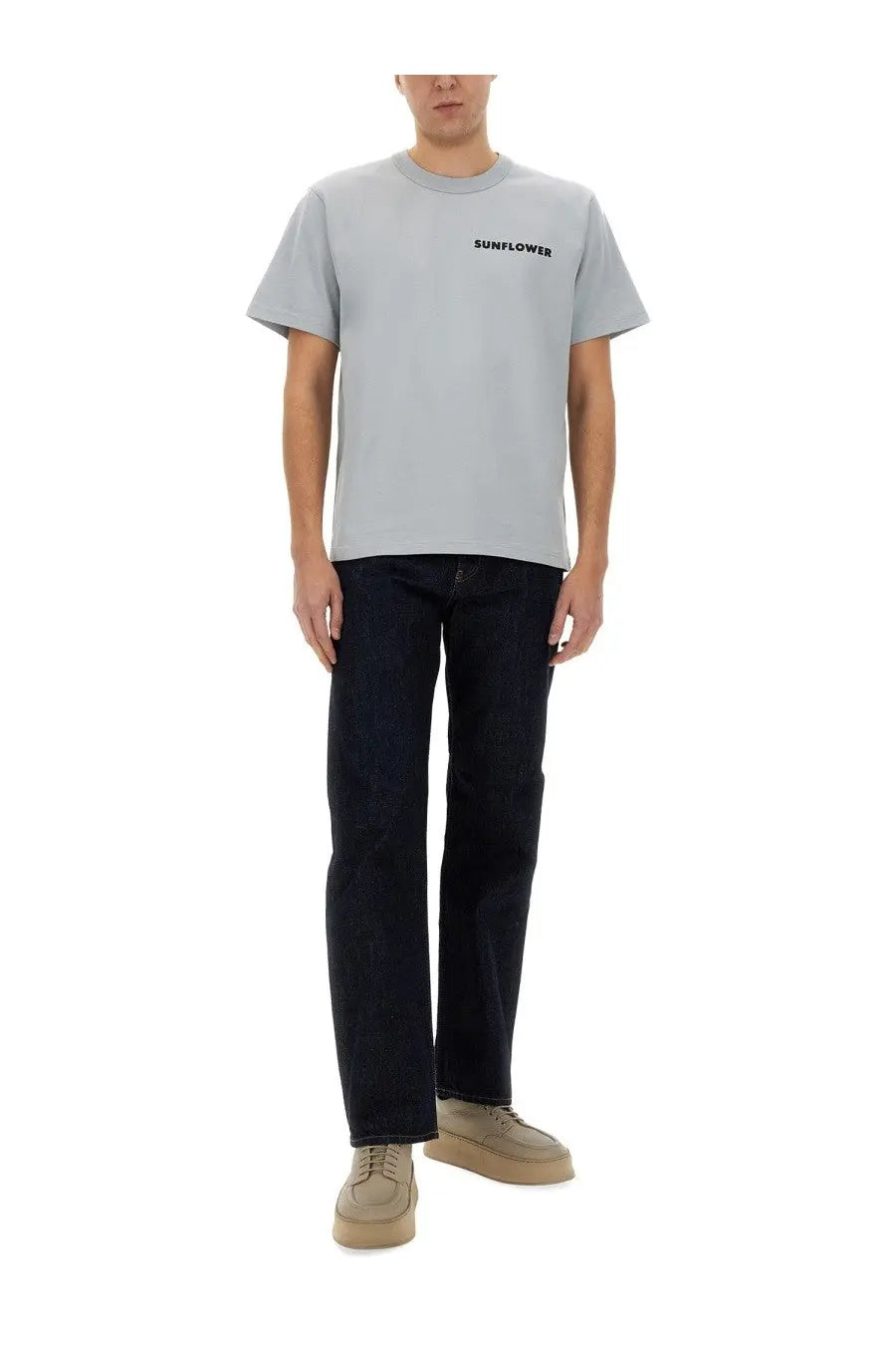 Light gray crewneck t-shirt with sunflower print in black paired with simple rinse blue men’s jeans