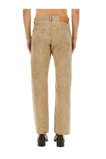 Beige denim straight-leg jeans for men with a brown leather brand patch at the waistband back view