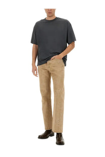 A pair of beige sunflower men’s straight twist denim jeans with subtle distressed texture along outer seams