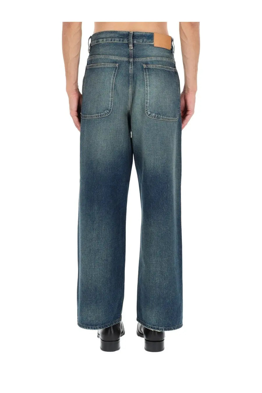 Blue denim sunflower men’s super wide jeans with faded wash and classic back pockets shown from the back side