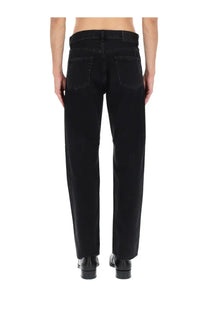 Black denim sunflower men’s wide twist jeans with straight-leg cut and classic back pockets shown from the back