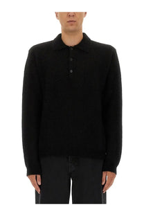 Black knit polo shirt with classic collar and buttoned front made from wool for men by sunflower
