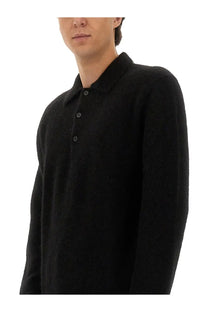 Black textured knit wool polo shirt with classic collar and buttoned front from sunflower men’s wool sweater black collection